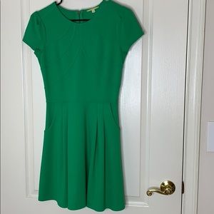 Green, fitted dress.